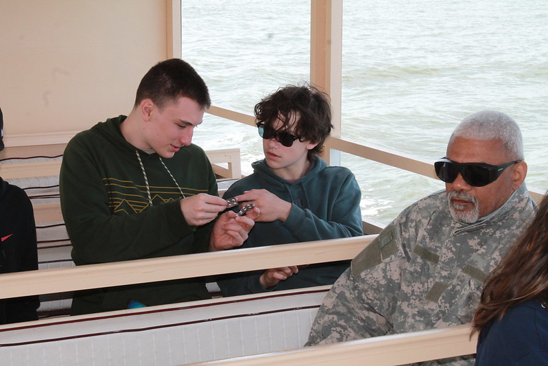 Picture of students using the tablets for testing water quality